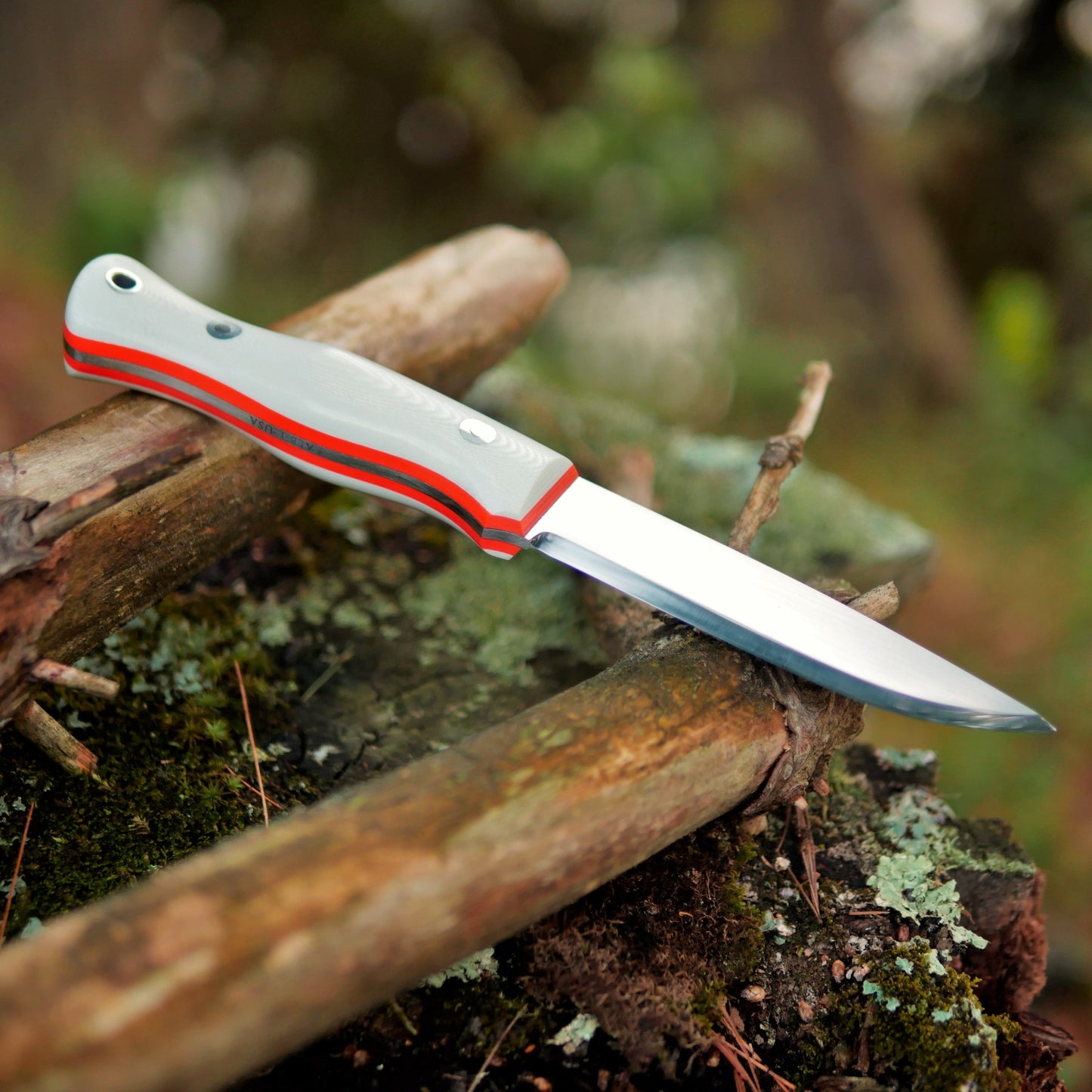 Explorer: AEB-L, White G10 with Orange G10 Liners