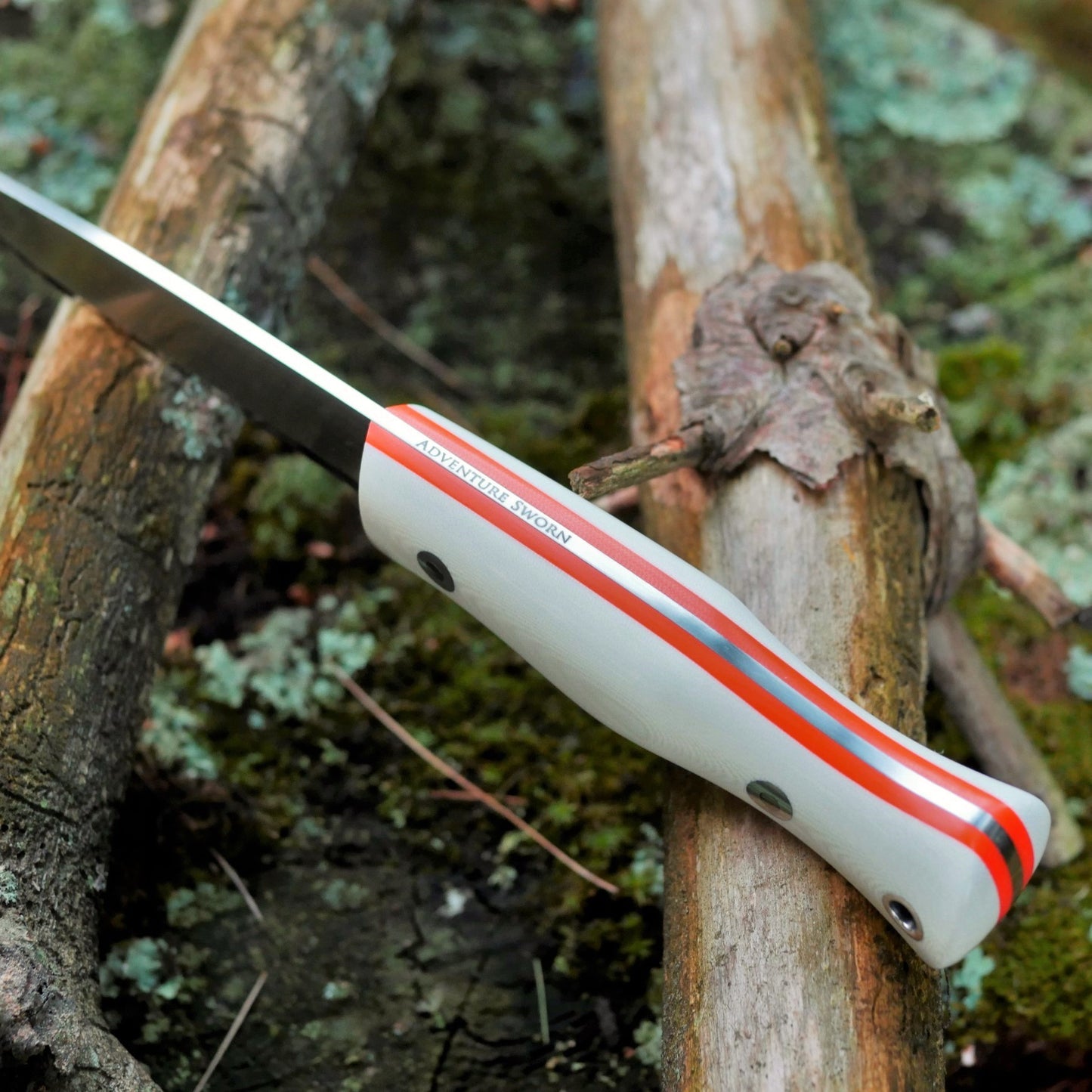 Explorer: AEB-L, White G10 with Orange G10 Liners