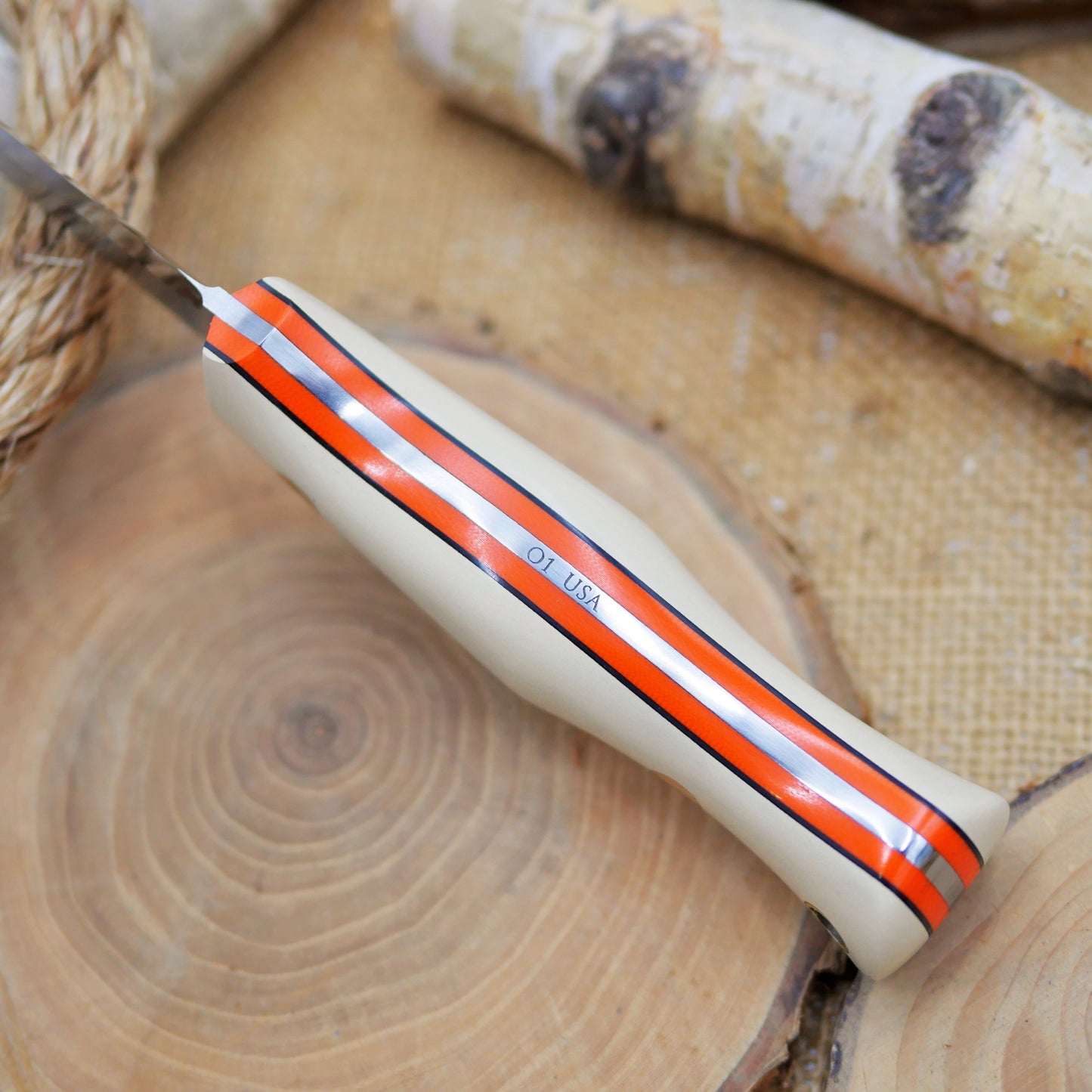 Explorer: Ivory Paper Micarta , Orange & Black Liners