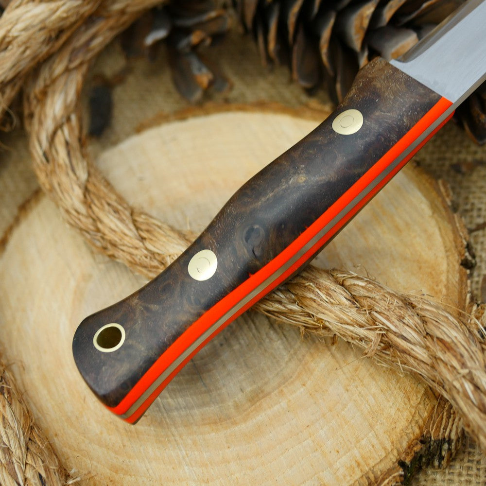 A Voyageur bushcraft knife with stabilized maple burl and hunter orange g10 liners.