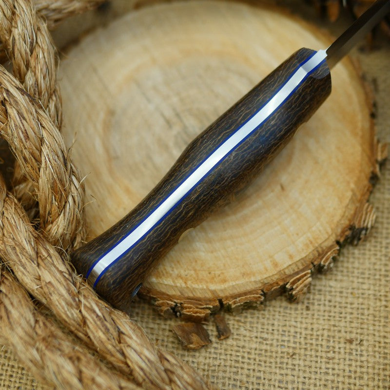 An Adventure Sworn Mountaineer with coffee bag burlap handle scales and thin blue liners