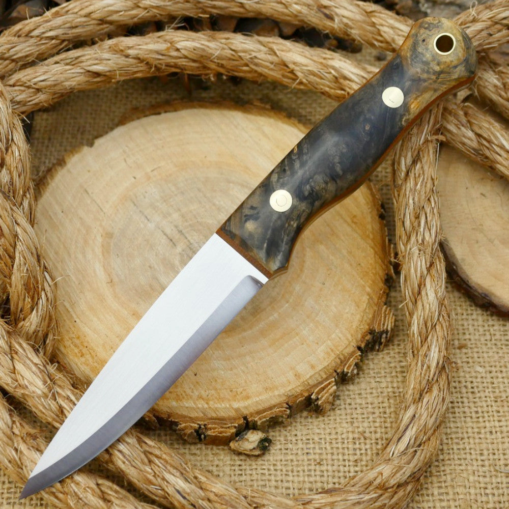 An Adventure Sworn Mountaineer bushcraft knife with Ohio buckeye burl handle scales and brown canvas liners.