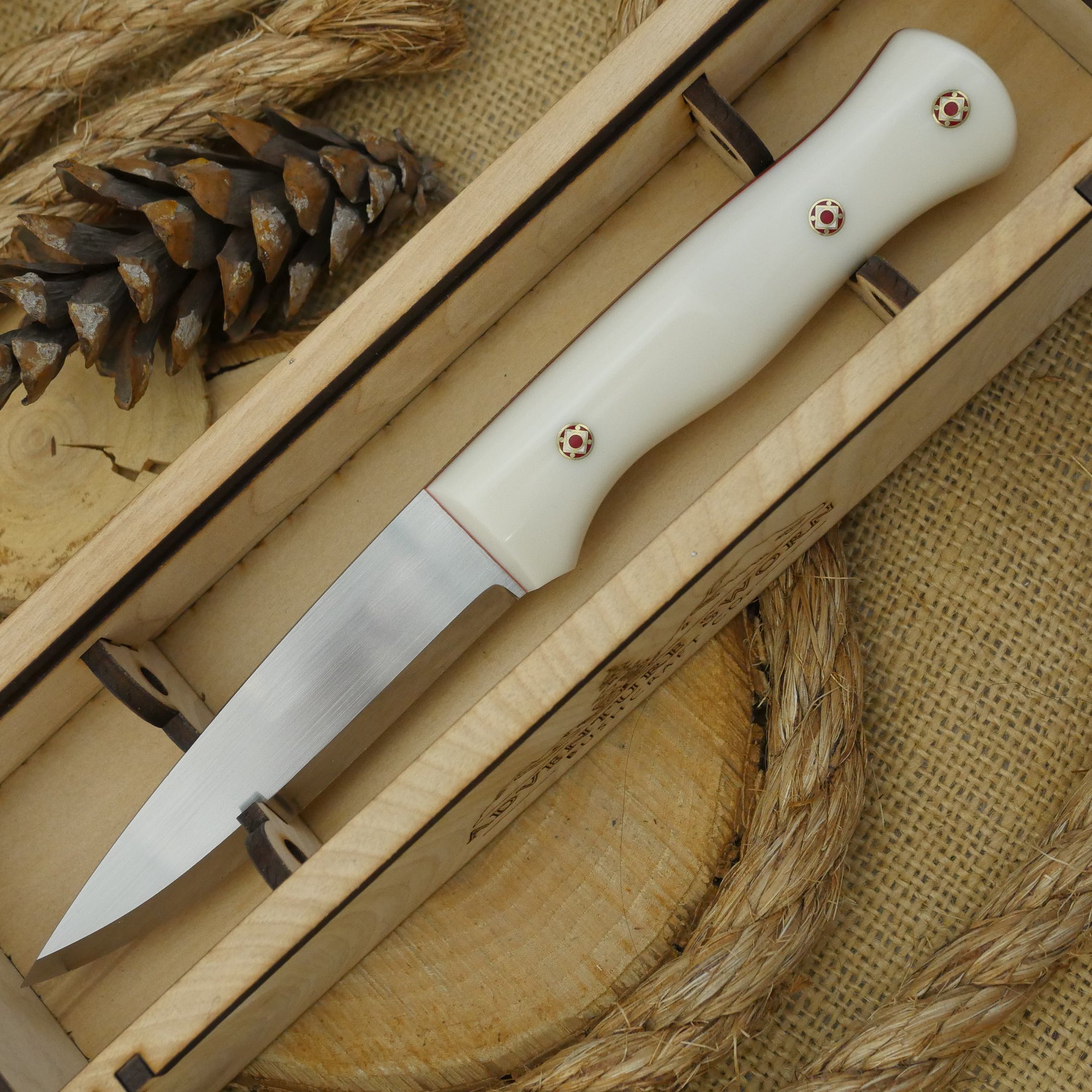 CPM 154 Mountaineer: Bone Corian, Cinnamon Liners & Mosaic Pins - Adventure Sworn Bushcraft Co.