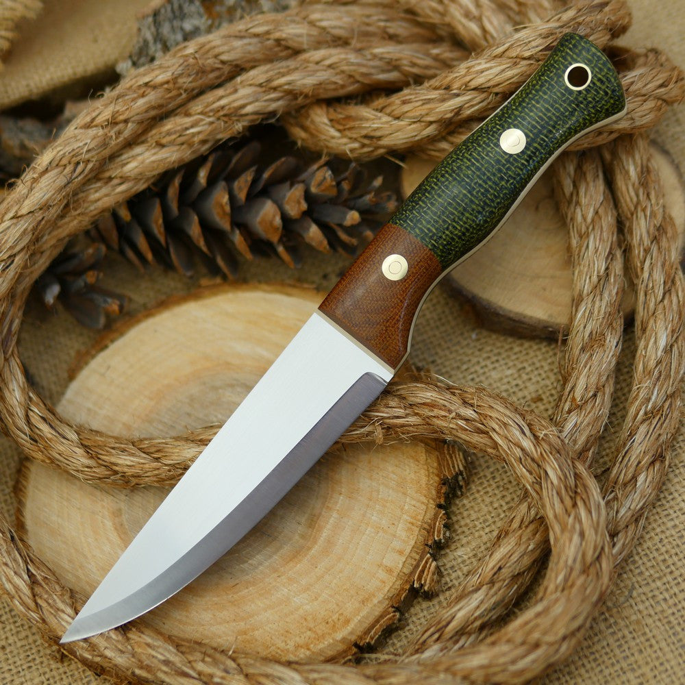 An Adventure Sworn bushcraft knife with evergreen burlap handle scales and natural brown canvas micarta bolster.