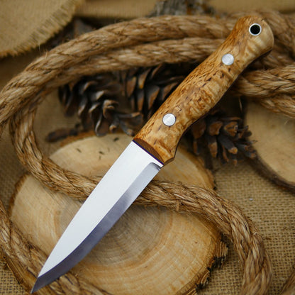 An Adventure Sworn Mountaineer bushcraft knife with karelian birch handle scales and thin blue and red liners.