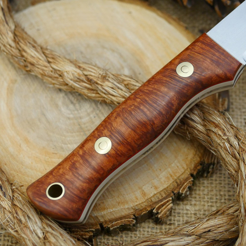 A Voyageur bushcraft knife with stabilized briar handle scales and ivory paper micarta liners