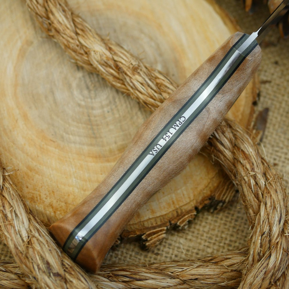 A Voyageur bushcraft knife with curly maple handle scales and double liners