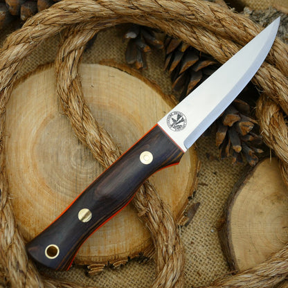 A Voyageur bushcraft knife with cocobolo handle scales and hunter orange g10 liners